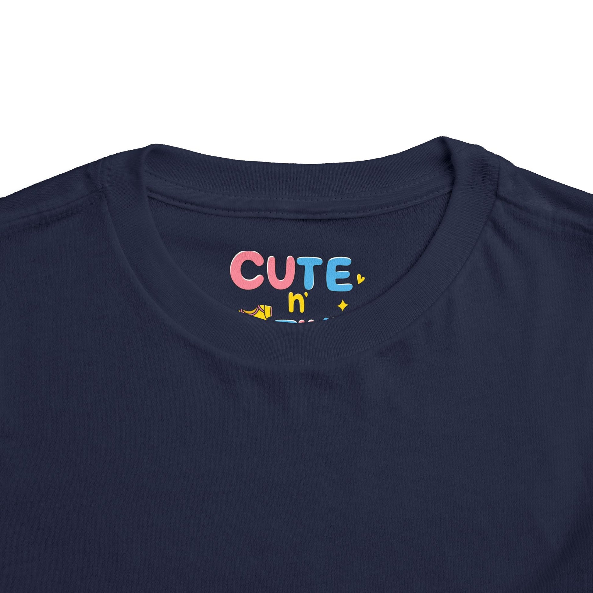 Navy blue shirt with colorful 'CUTE n' text on a white background