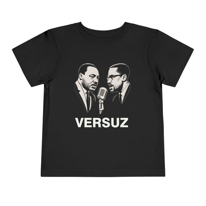 Black t-shirt with graphic of two men and a microphone, featuring the word 'VERSUZ'.