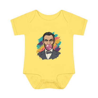 Yellow baby onesie with a colorful graphic of a historical figure on a white background