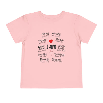 Pink t-shirt with motivational text and a red heart on a white background
