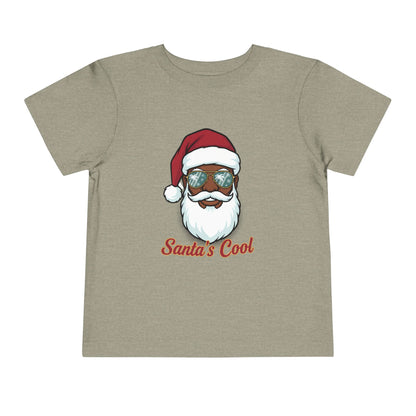 Beige t-shirt with a graphic of a Santa Claus face wearing sunglasses and 'Santa's Cool' text on a white background.