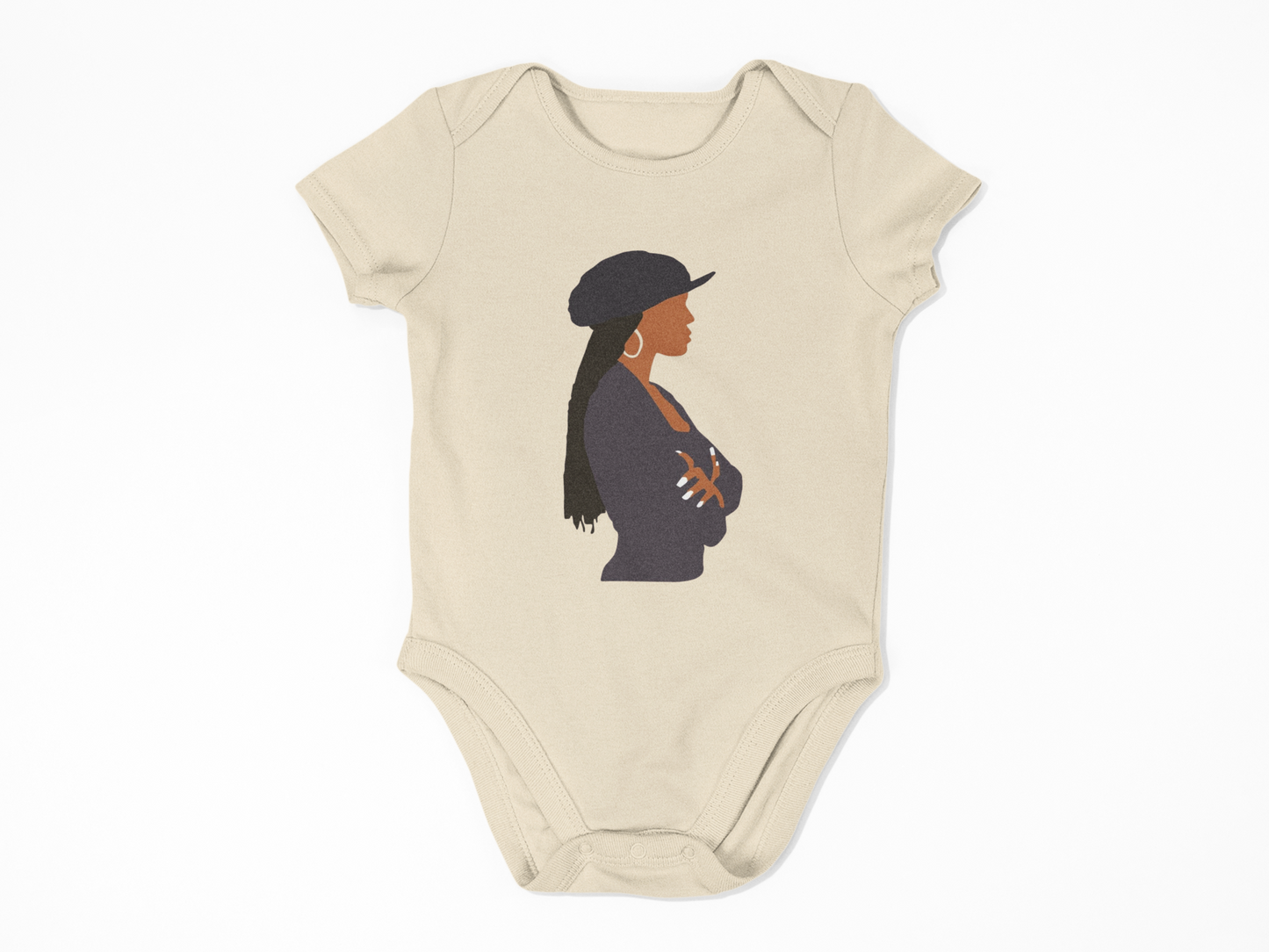 Beige baby onesie with a graphic of a woman wearing a hat on a white background